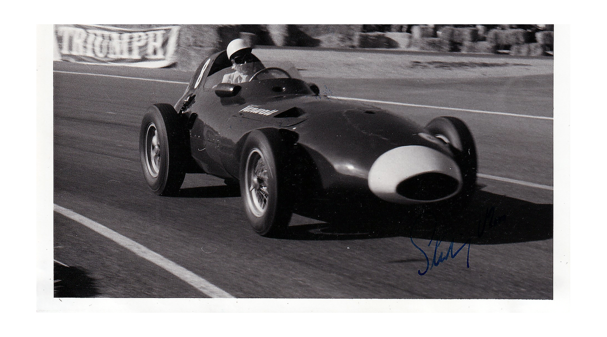 Stirling Moss autograph signature detail on vintage Autosport press photograph