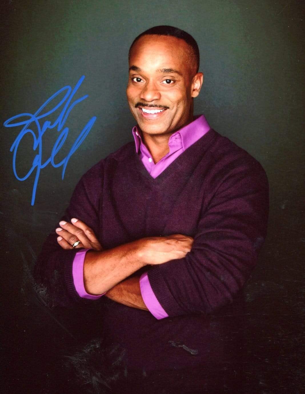 Rocky Carroll autograph | In-Person signed photograph
